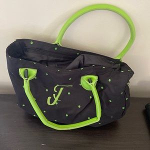 Green and black bag with letter